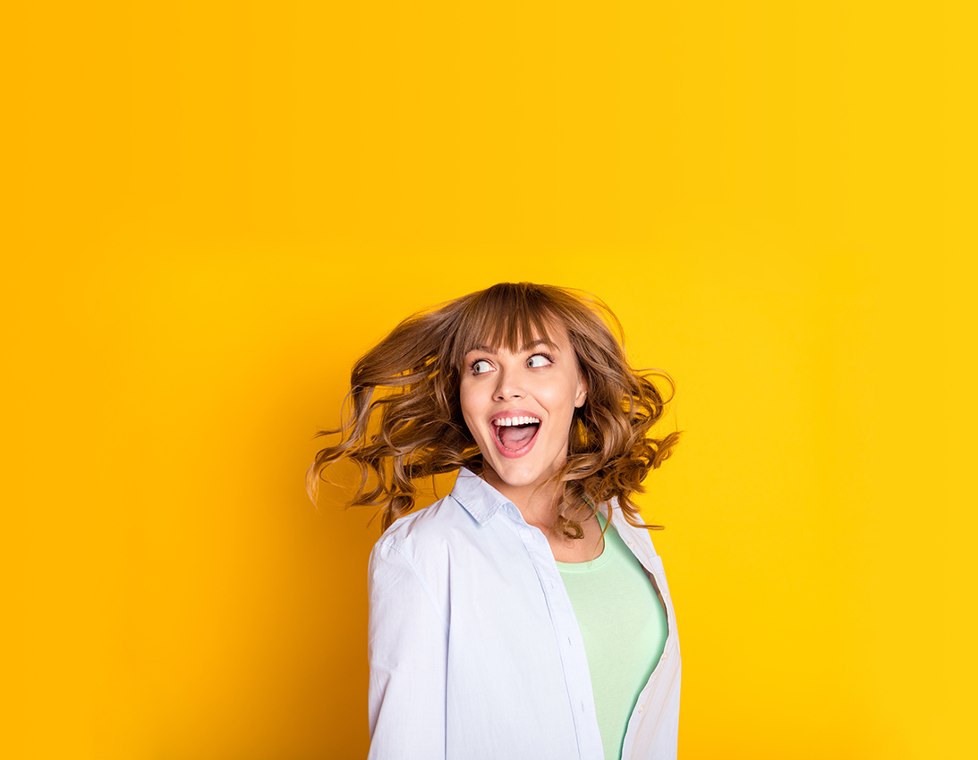 Profile photo of charming cheerful person open mouth look interested empty space isolated on yellow color background