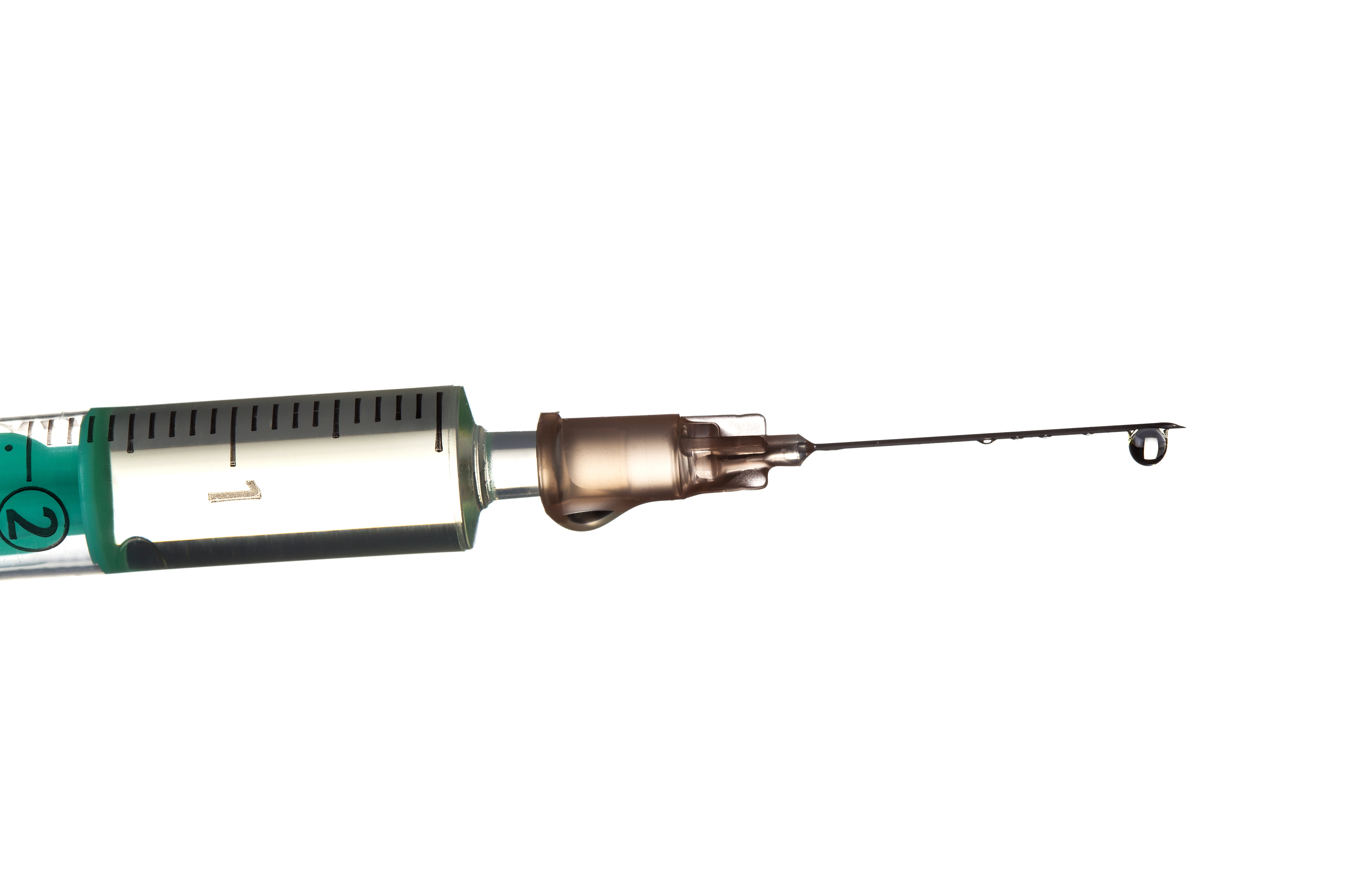 Drop on top of a syringe needle